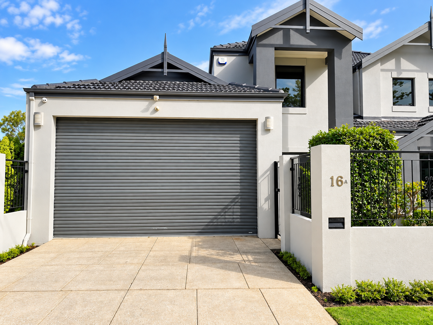 Modern Perth townhouse facade with newly painted render and garage door